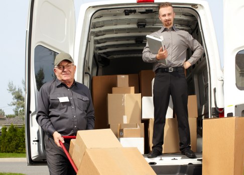 Loading household furniture into a removals van in Harrow Weald
