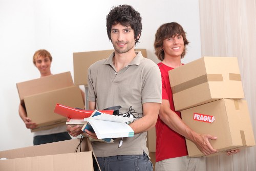 Loading household furniture into a removal truck