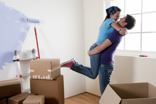 Mover handling boxes carefully during a house move
