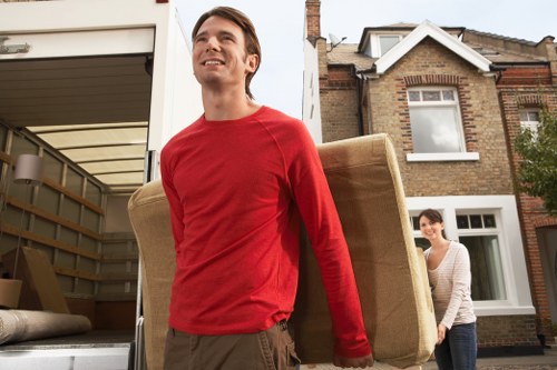 Professional moving team following safe working practices