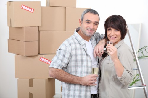 Local van team handling boxes and furniture for a home move