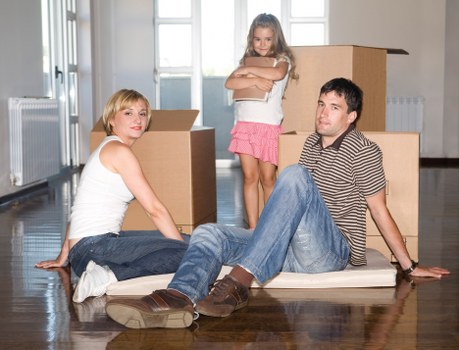 Local commercial movers loading boxes and desks safely